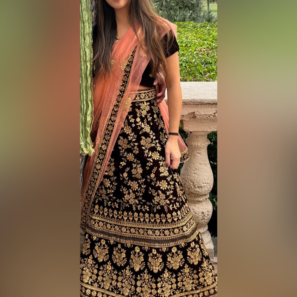 Elegant maroon and Gold Embroidered top skirt and scarf drape lehenga